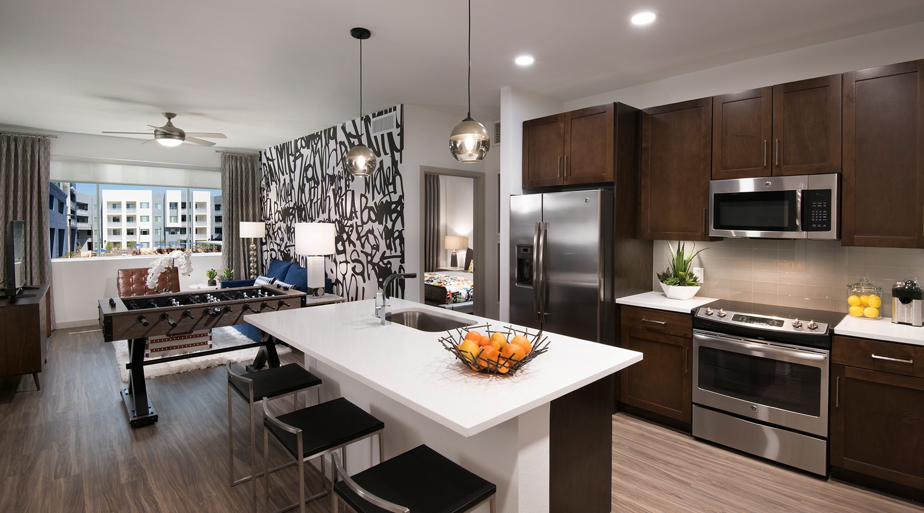 Open-concept kitchen and living room at Nexa apartments in Tempe, AZ