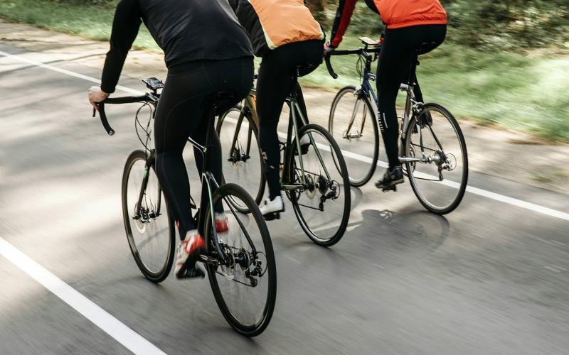 a group of people riding bikes