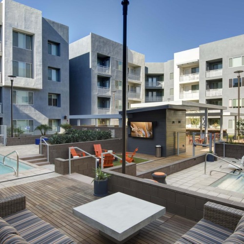 The essence of exceptional living a courtyard with a lamp post and hot tubs and seating