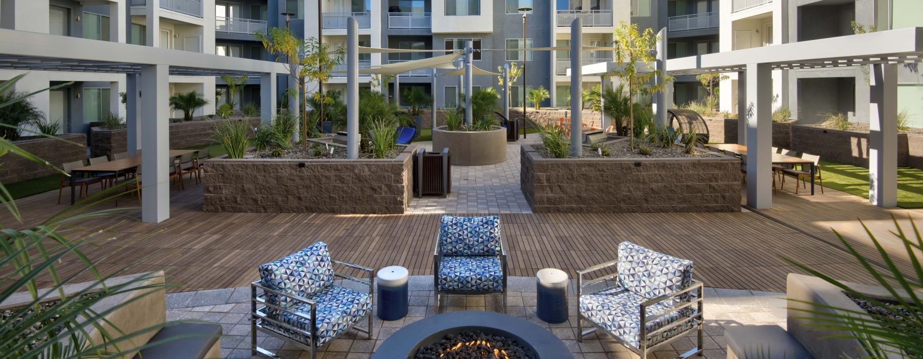 Courtyard with seating and fire pit at Nexa's nice apartments in Tempe, AZ