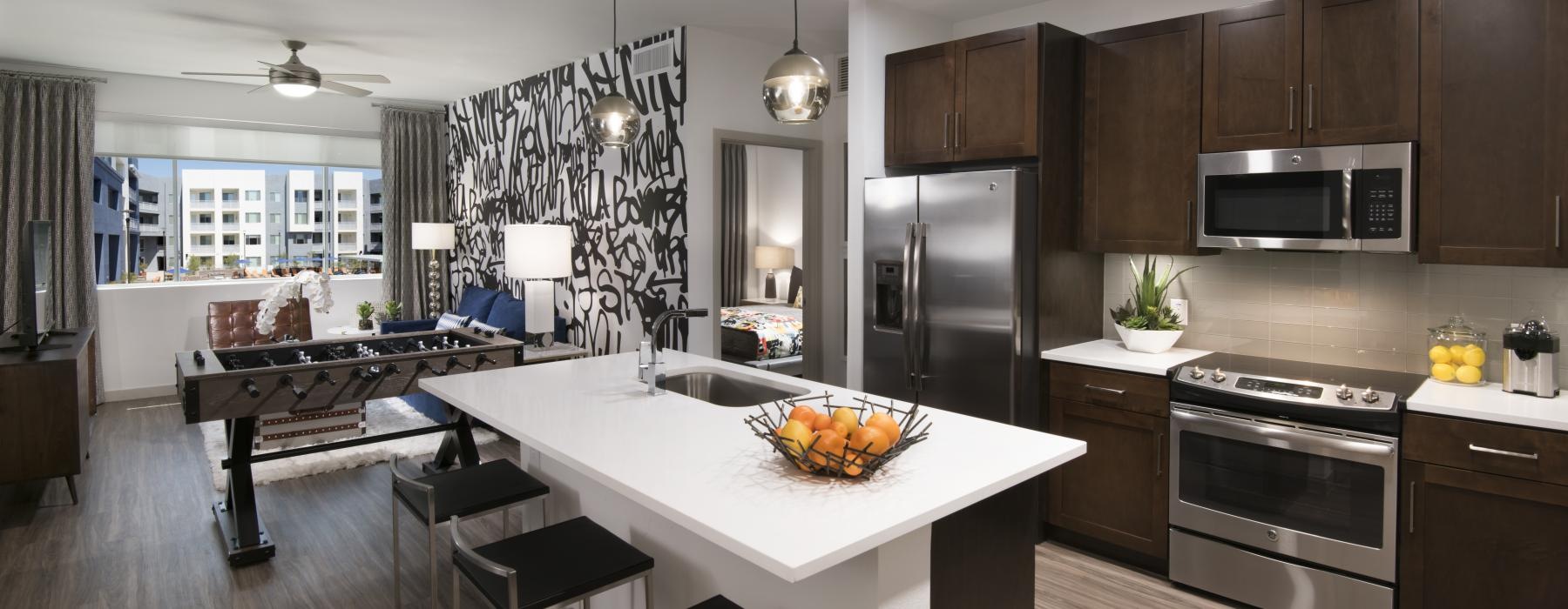 a kitchen with a table and chairs